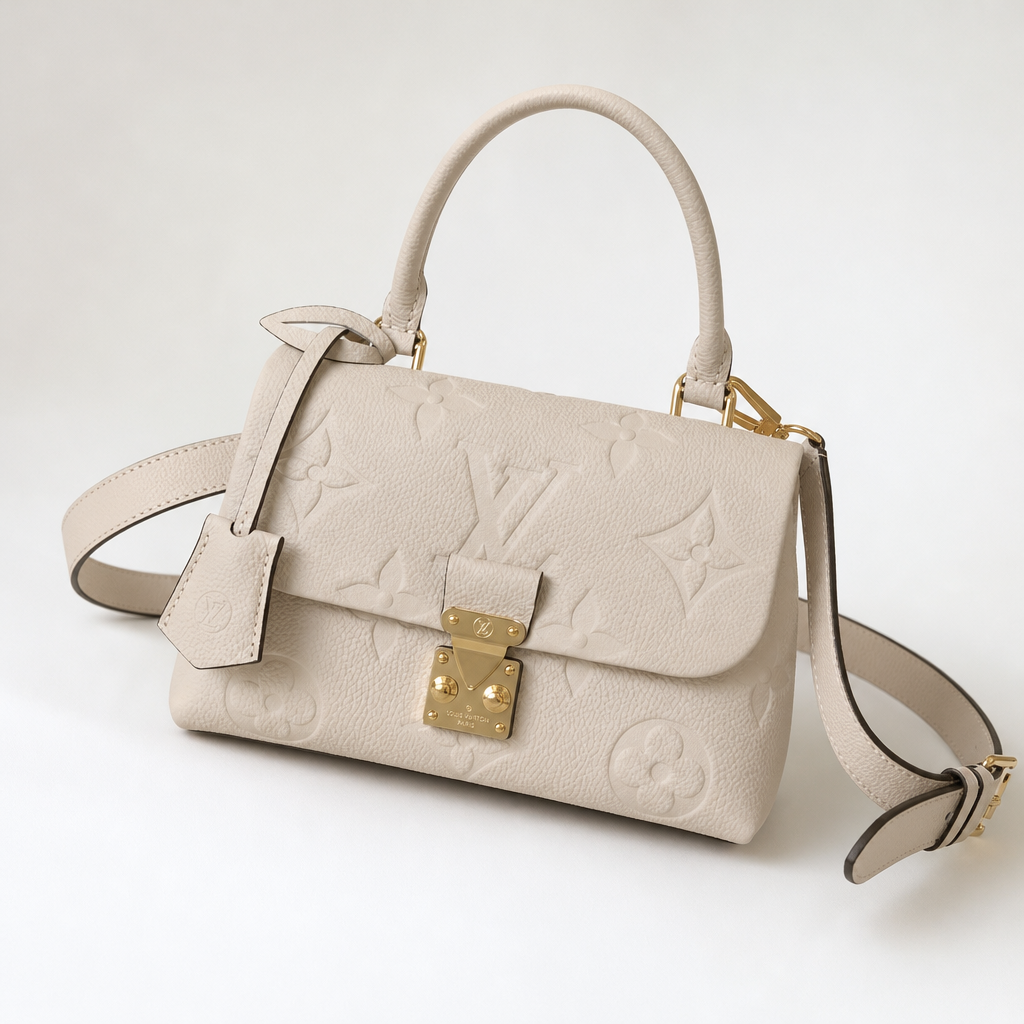 Embossed Monogram Top Handle Bag — detail