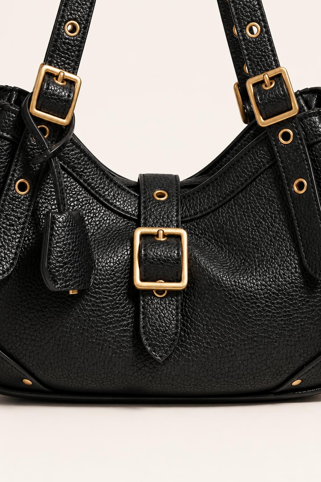 Buckle-Detail Slouchy Shoulder Bag — carrying view