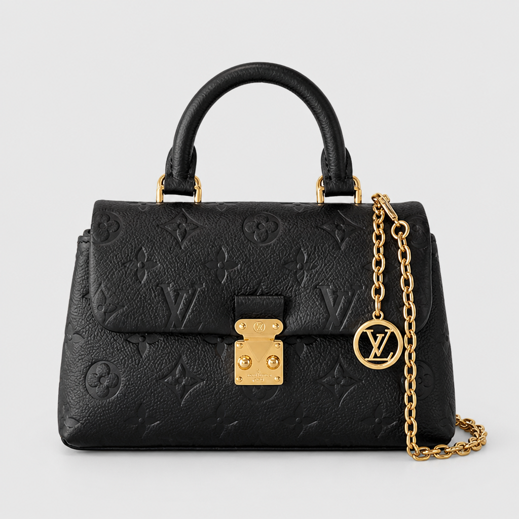 Small black embossed monogram, gold chain — front view.